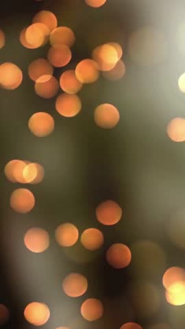 sstkVertical video abstract bokeh background animation with fast flickering defocused warm golden bokeh light spheres. This stylish elegant motion background is full HD and a seamless loop light shine