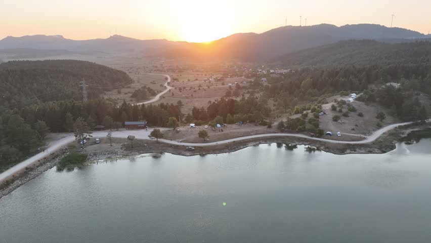 Peaceful natural lake scenery surrounded by serene landscapes and untouched nature. Embrace tranquility and the beauty of the great outdoors