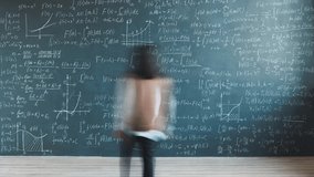 Zoom-in time lapse of young lady researcher solving equations writing on chalkboard in university laboratory. Science development and intelligent person concept. - Powered by Shutterstock - Get 15% off with code: PIKWIZARD15