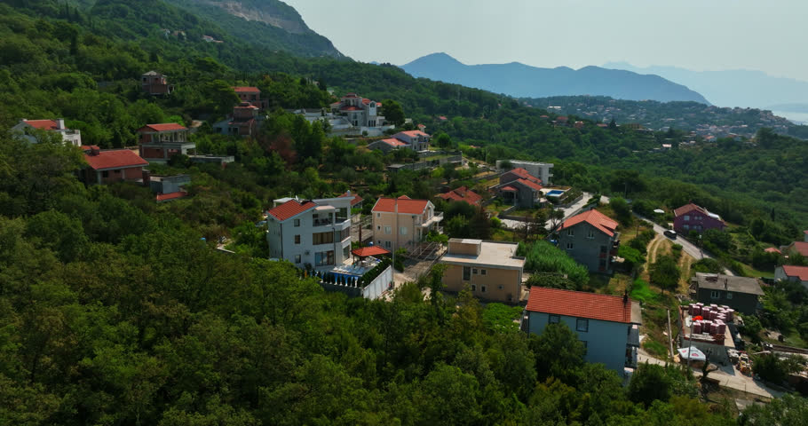 Drone circing rich homes in the hills of Herceg Novi, Montenegro, summer day