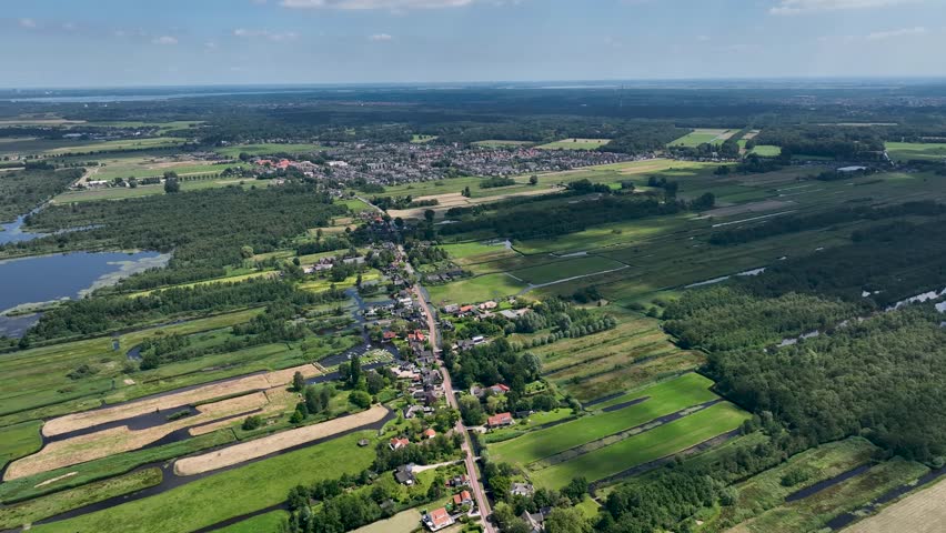 Typical Dutch landscape with narrow elongated meadows and ditches