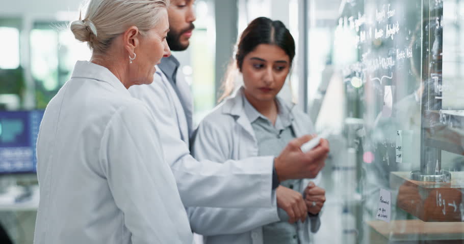 Science, team and writing on board in lab for tracking experiment progress, brainstorming and research. Glass, collaboration and people with formula for prediction, analysis and scientific theory.