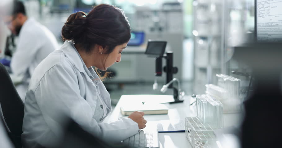 Scientist, keyboard and woman typing research for test, exam and drug development report in lab. Medical science, biotechnology and chemical engineer on computer for innovation, study or healthcare