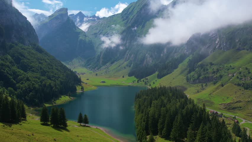 Aerial of beautiful mountain lake Seealpsee in Alps of Switzerland Sunny summer day
