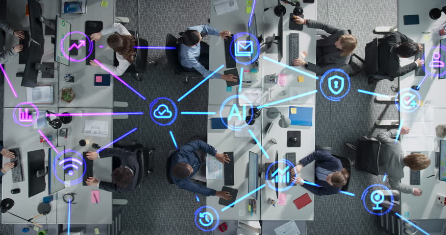 Top Down View of Employees Working in Office, Utilizing Artificial Intelligence Productivity Tools. Holographic Interface Icons Visualize Interaction and Advanced Tech Integration Within the Team