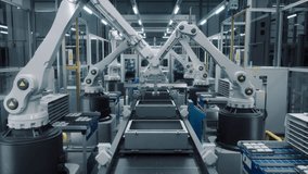 High Tech Factory with White Robotic Arms Assembling Electronic Components on a Production Line Conveyor Belt. Automation and Artificial Intelligence in a Modern Manufacturing Process. High Angle - Powered by Shutterstock - Get 15% off with code: PIKWIZARD15