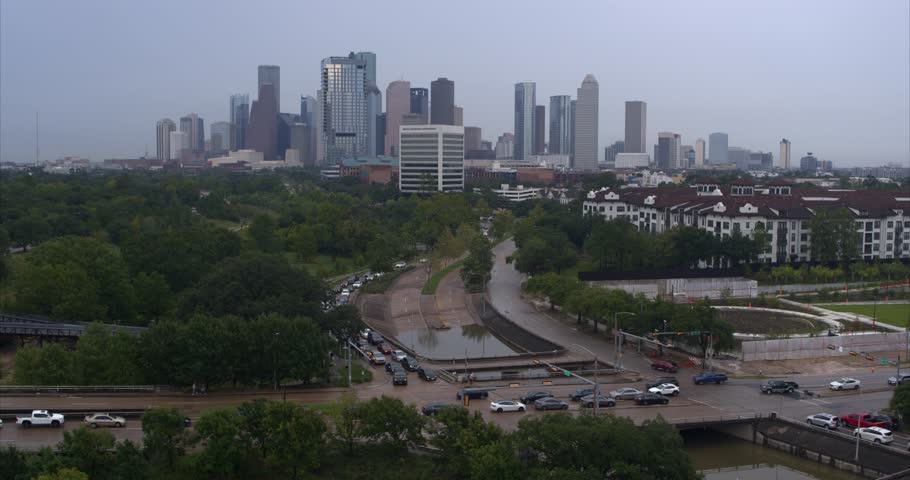 Establishing shot of downtown Houston, Texas and Allen Parkway street