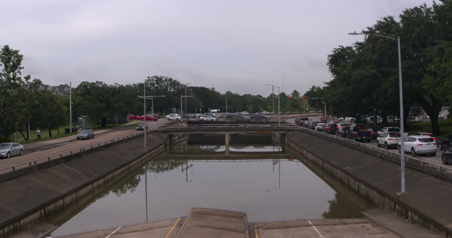 Ascending shot of under bridge flooding on Allen Parkway in Houston, Texas