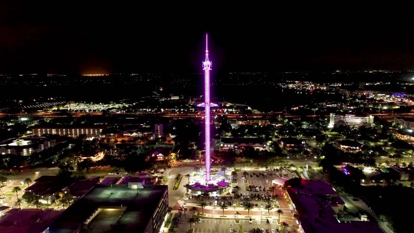 Night Amusement Park At Orlando Florida United States. City Skyline Showing Modern And Traditional Architecture. Building Town Clouds Sky Illuminated Urban. Town Outside Illuminated .
