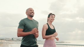 Running woman and man enjoy their summer morning workout. Team sports. Couple goals and motivation. Happy fit people are cheerfully doing sports - Powered by Shutterstock - Get 15% off with code: PIKWIZARD15