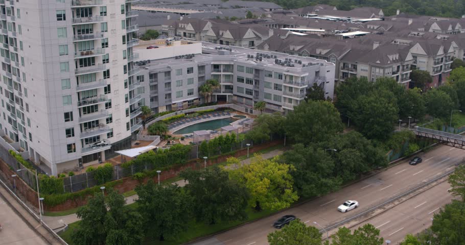 Reveal drone shot of the Buffalo Bayou and surrounding area in Houston, Texas