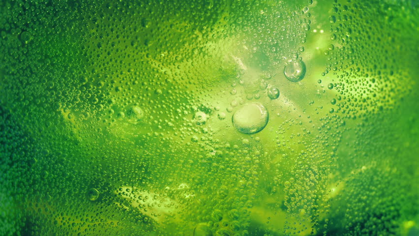 Lime Soda Fizzing With Ice Extreme Closeup