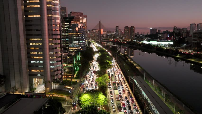 Freeway Traffic At City Sunset Sao Paulo Brazil. Stunning Landscape Of Highway Road Viewed From Above. Building Town Sky Clouds Illumination Urban. Outdoors Panoramic City. City Sunset Sao Paulo.