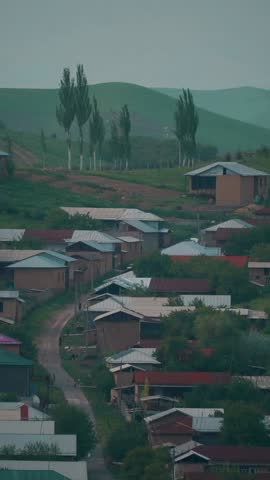 Village houses can be seen at the foot of the mountain