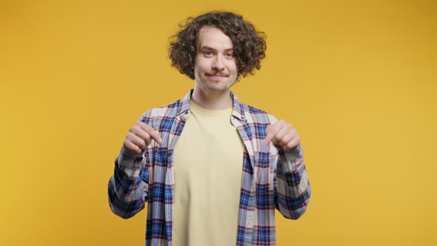 Blogger man pointing down to advertising area.Yellow background.Click, subscribe