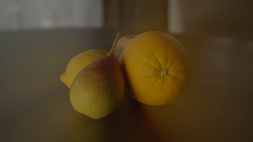 Three fruits on a table with microstock plus written on the bottom