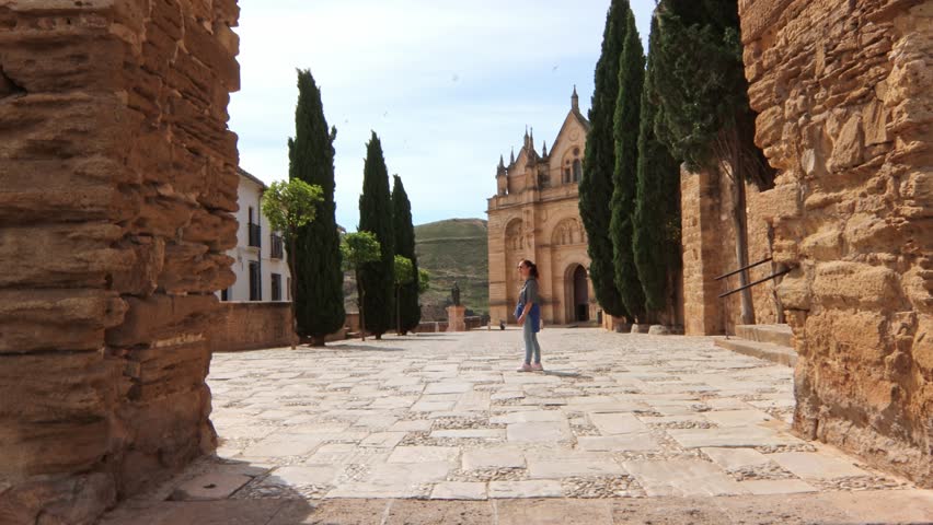 The Alcazaba of Antequera is a Muslim fortress with uncertain origins, built using Roman materials, and declared a Site of Cultural Interest in 1985. It has three towers. Caucasian mature woman posing