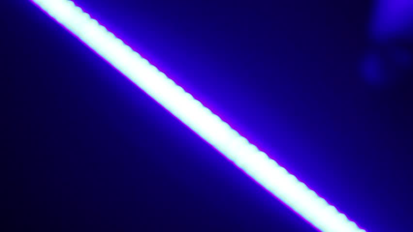 Abstract image of moving diagonal line and it's flare shot in night club during