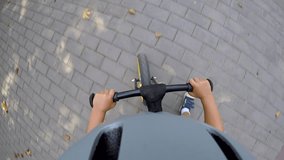Little child in safety helmet riding balance bike on path in park in summer, action camera pov. - Powered by Shutterstock - Get 15% off with code: PIKWIZARD15