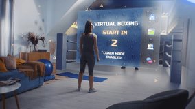 Sportswoman in AR headset starts online boxing training. VR screen shows virtual coach and interface of boxing app. Athletic woman exercises in metaverse futuristic home gym with AI technologies. - Powered by Shutterstock - Get 15% off with code: PIKWIZARD15