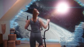Woman wears on AR headset and starts workout on orbitrek simulator. VR screen shows image of the universe. Sportswoman trains using high tech virtual reality technology. Metaverse futuristic home gym. - Powered by Shutterstock - Get 15% off with code: PIKWIZARD15