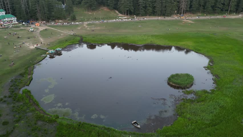 4K drone shot of Mini Switzerland in Khajjiar with the view of Khajjiar Lake, Himachal Pradesh India.