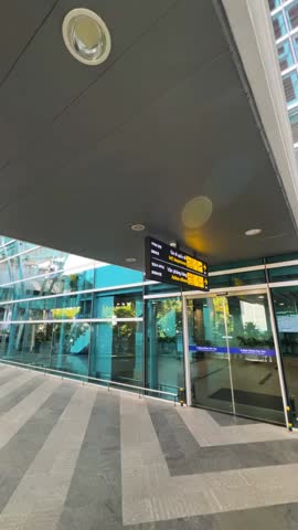 Footage showcasing various airport signage, providing essential directions for travelers. Multilingual signs guide passengers through terminals, parking, and other airport areas.