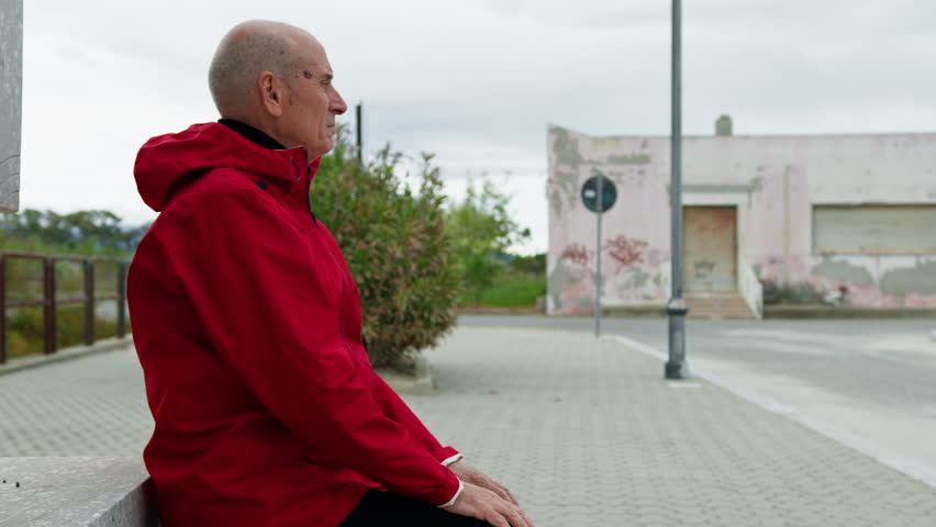Sitting Man Waiting For The Bus To Arrive