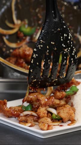 Cooking teriyaki chicken with rice, street food style. panning shot of Japanese food rice serves with chicken in Teriyaki sauce