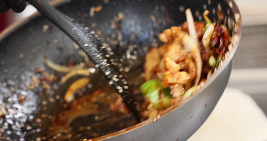 Cooking teriyaki chicken with rice, street food style. panning shot of Japanese food rice serves with chicken in Teriyaki sauce