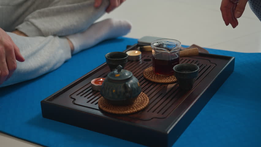 Tea table ceremony calm peaceful harmony health fragrant aroma drink hot black romance relaxation recuperation refreshment pouring cup serving teapot teacup traditional herb beverage liquid medicine