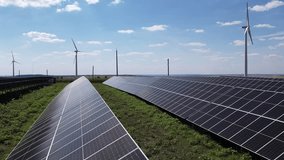 Windmill turbines and solar panel generating green energy electric.Photovoltaic power station and wind turbines.Green energy reduce carbon emissions and makes earth cleaner and more ecological. - Powered by Shutterstock - Get 15% off with code: PIKWIZARD15