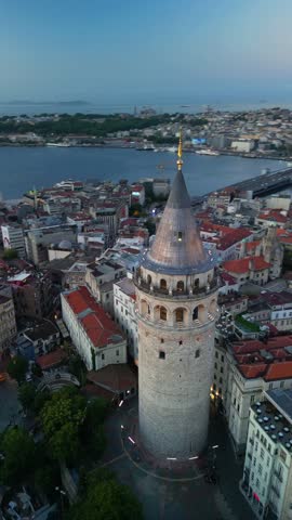 Breathtaking 360° drone view of Istanbul at dawn, circling Galata Tower. Captures city