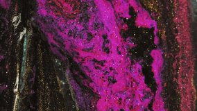 Shimmering fluid spill. Glitter ink flow. Defocused pink black golden color shiny gloss paint water blend drip bokeh light texture abstract art background. - Powered by Shutterstock - Get 15% off with code: PIKWIZARD15