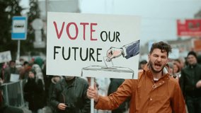Presidential campaign for run office. Angry man activist hold protest our future banner. President elections political rally. Vote day. Voter people crowd riot city street. Elect us strike placard. - Powered by Shutterstock - Get 15% off with code: PIKWIZARD15
