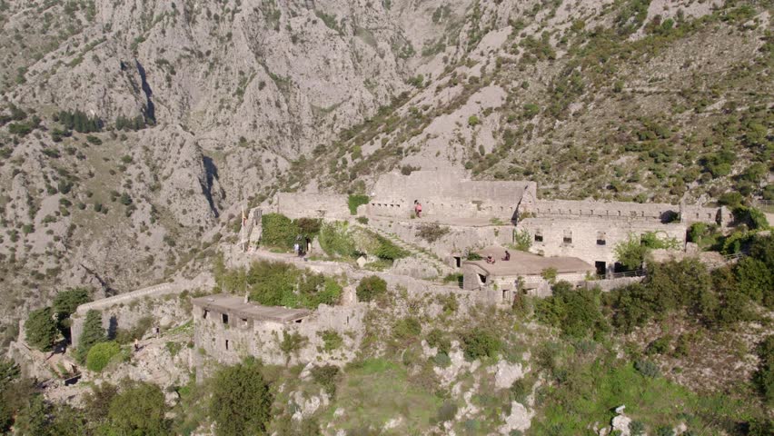 Aerial view of medieval town and bay with mountain ruins and stairs, Kotor Bay, Montenegro.
