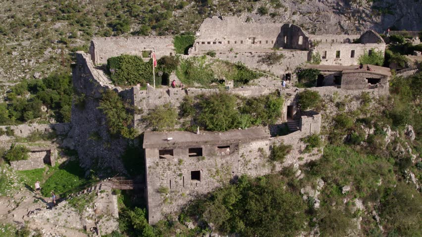 Aerial view of medieval fortress ruins overlooking Kotor Bay, Montenegro.