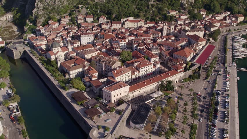 Aerial view of medieval city with bay and mountain backdrop, Kotor Bay, Montenegro.