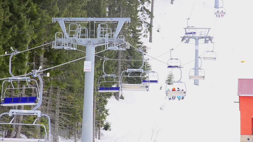 ski resort, chair ski lift elevator lifting people on the mountain ski slope