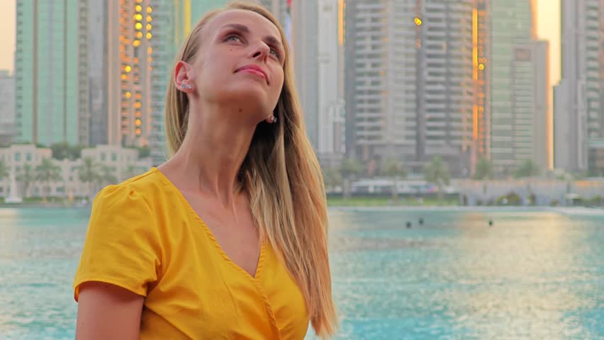 Woman tourist watching Burj Khalifa . High quality 4k footage