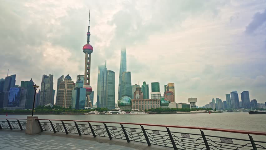 4K Timelapse - Uraban skyline and cityscape at sunrise on cloudy day in Shanghai China. footage of city skyline and modern buildings in Shanghai, China. Famous city landmarks in Shanghai China