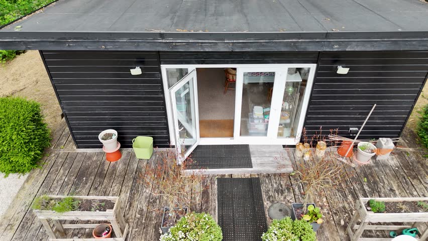 Caucasian man enters his garden shed