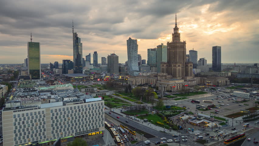 warsaw modern city timelapse day to night business district,time lapse of central town lighting up at sunset