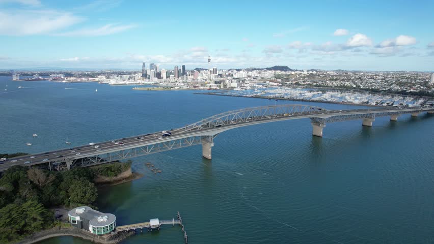 Aerial View Of Auckland Harbour Bridge On Northcote Point Ferry Terminal, Auckland CBD, New Zealand.