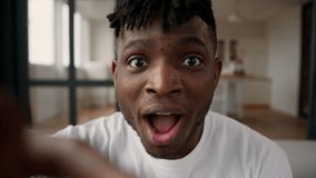 POV webcam smartphone point of view African American man typing touchscreen keyboard using mobile phone addict online chatting cellphone screen shock read amazing news win happy excited male guy home - Powered by Shutterstock - Get 15% off with code: PIKWIZARD15