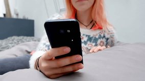 Animation of network of connections with people icons over caucasian woman using smartphone. Global business, connections, computing and data processing concept digitally generated video. - Powered by Shutterstock - Get 15% off with code: PIKWIZARD15