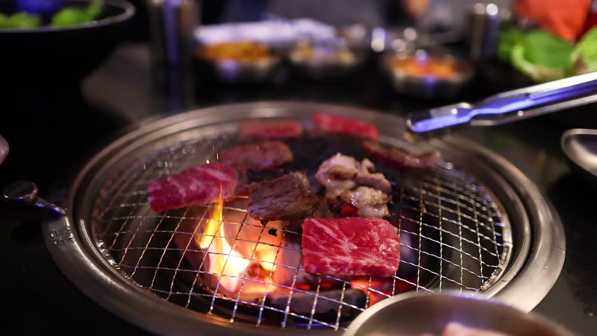 Meat grilling on a Korean BBQ grill