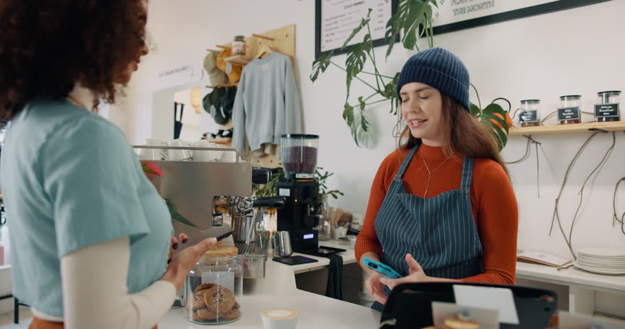 Woman, cashier and pos payment in cafe for coffee purchase, transaction or scanning mobile. Service, barista and customer at restaurant for bill, nfc machine or point of sale with smartphone