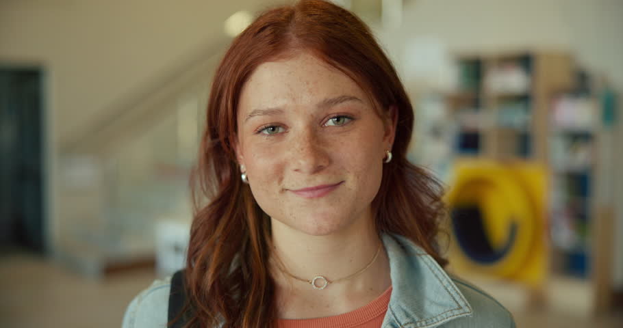 High school, student and face with happiness for education, pride for knowledge or learning. Teenage girl, smile and excited for scholarship opportunity at academy, youth with commitment to study