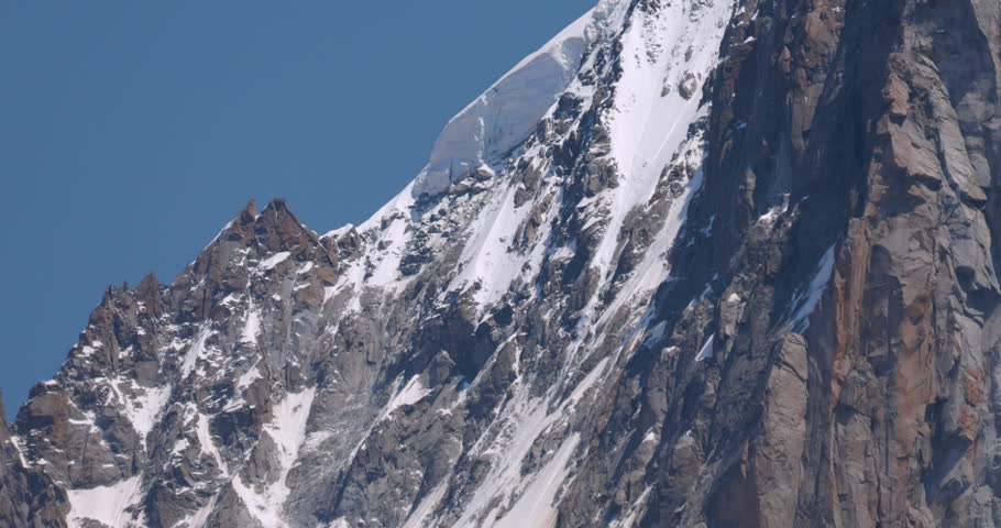 The Epic Peak Of The Chamonix Mont Blanc Mountains Among The Clouds, France